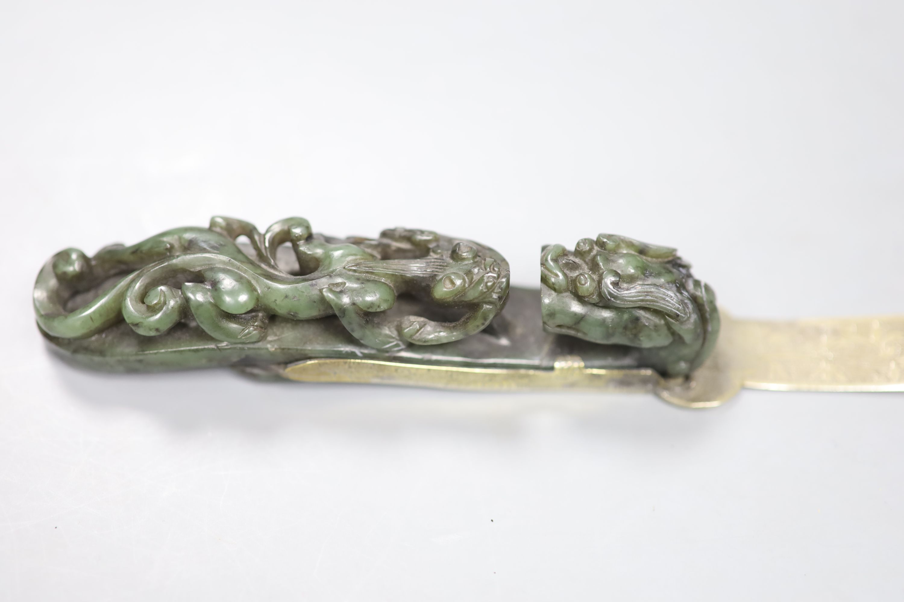 An 18th/19th century Chinese spinach green jadeite dragon belt hook, mounted as the handle for a paperknife, length 32cm